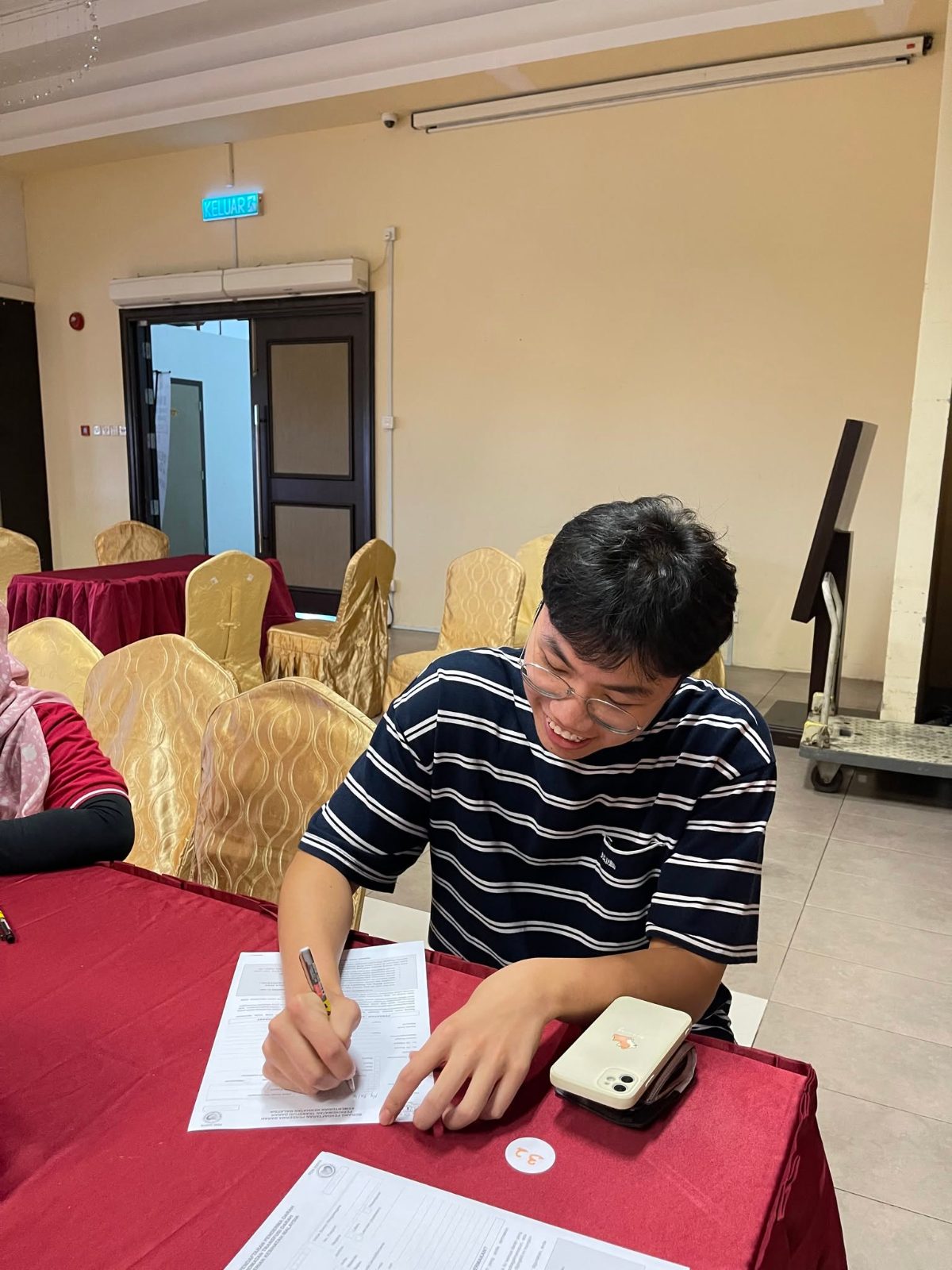 Employee filling in a donor form at the 2024 Blood Donation Drive