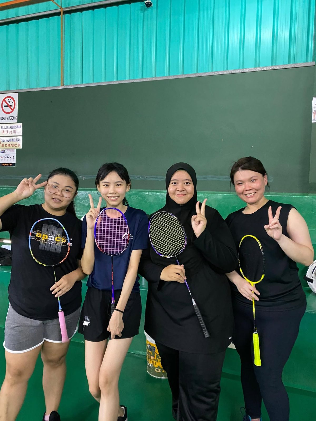 Staff players posing at the 2024 staff badminton tournament